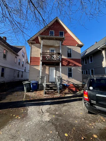 a front view of a house with parking space