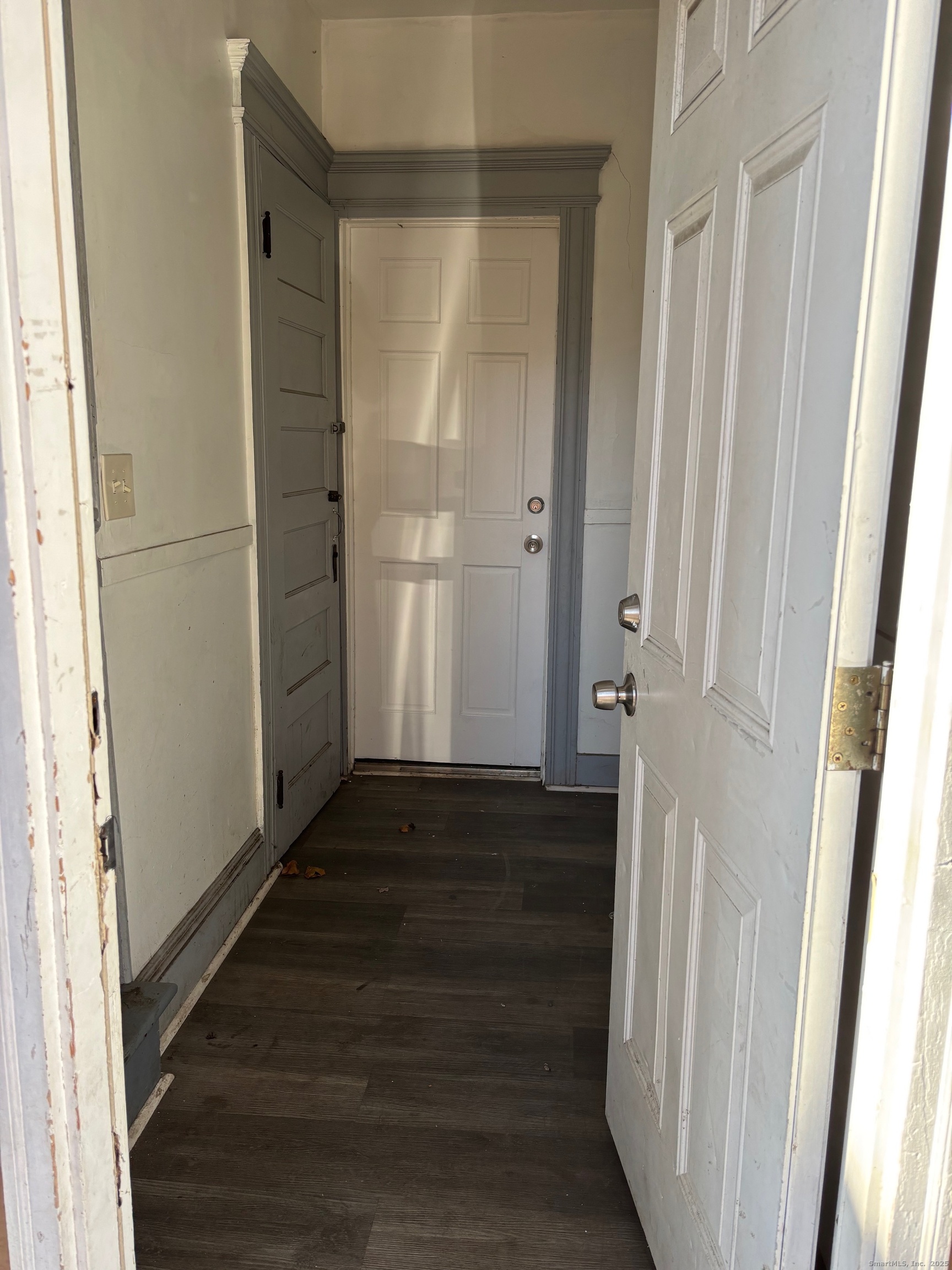 464 Wilmot Avenue Bridgeport, CT 06607 - Photo 6 of 19 a view of a hallway with wooden floor and staircase