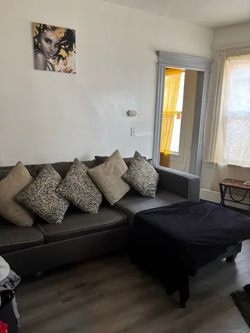 a living room with furniture and a window