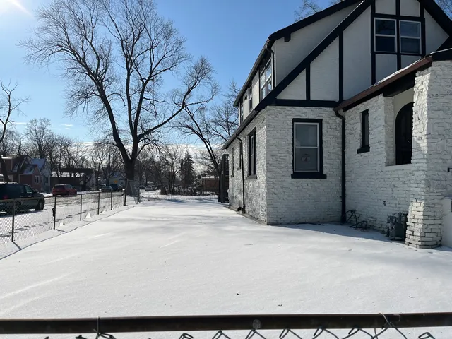 a backyard of a house with large trees
