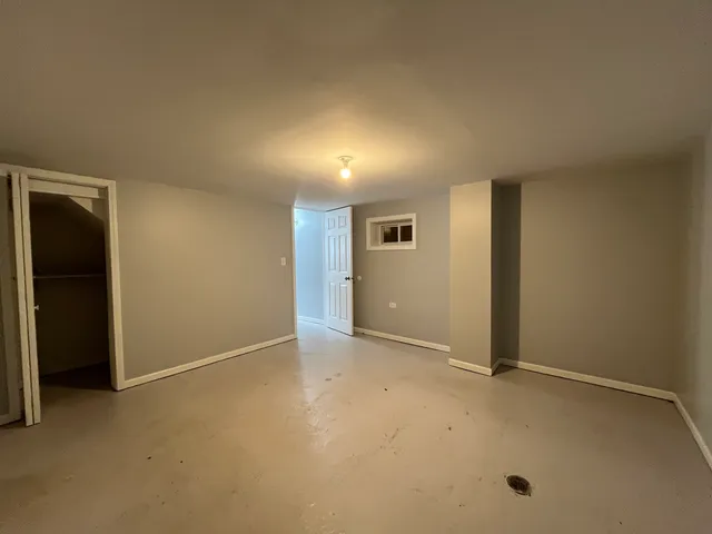 an empty room with closet area