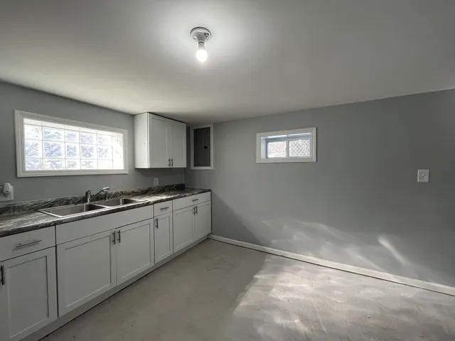 a kitchen with sink and window