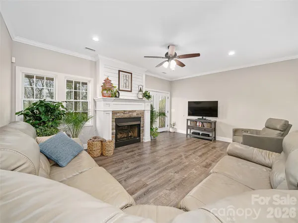 a bedroom with a bed and a ceiling fan