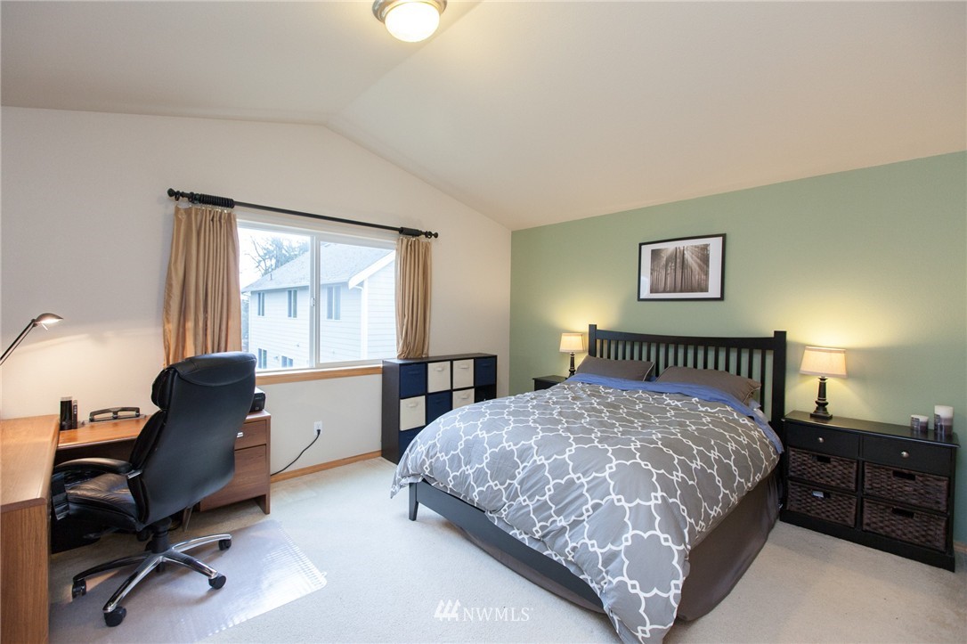 6745 Southeast 5th Street Renton, WA 98059 - Photo 14 of 25 a bedroom with a bed a desk and chair next to a window
