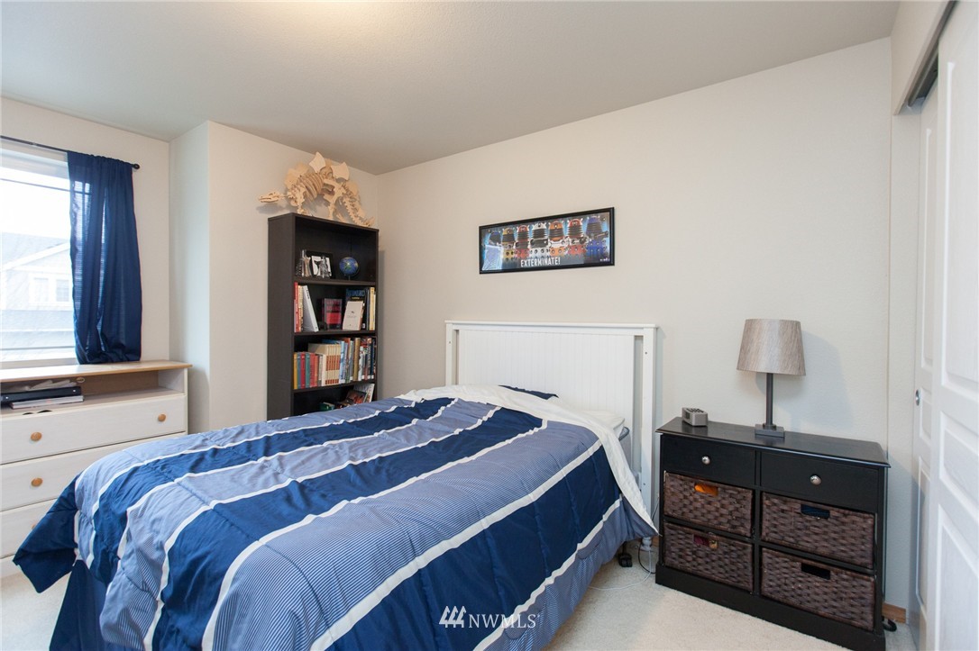 6745 Southeast 5th Street Renton, WA 98059 - Photo 21 of 25 a bedroom with a bed and a window