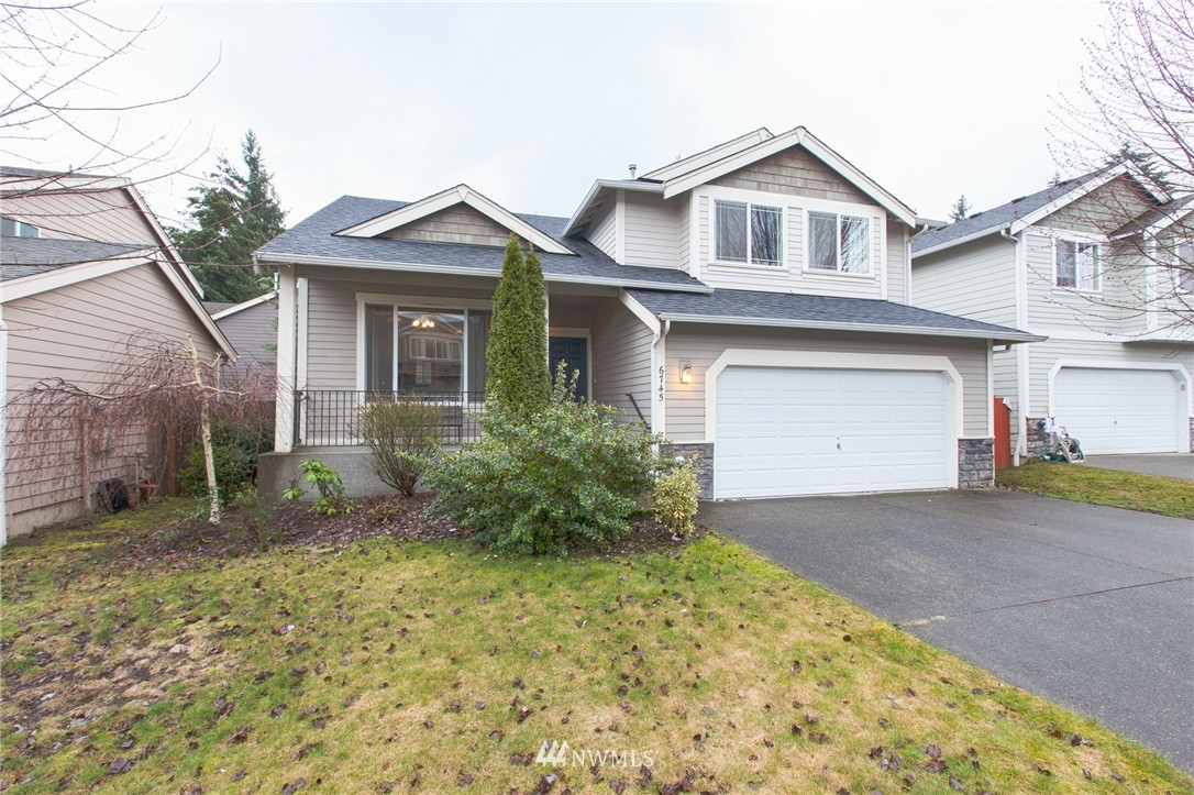 6745 Southeast 5th Street Renton, WA 98059 - Photo 25 of 25 a front view of a house with garden