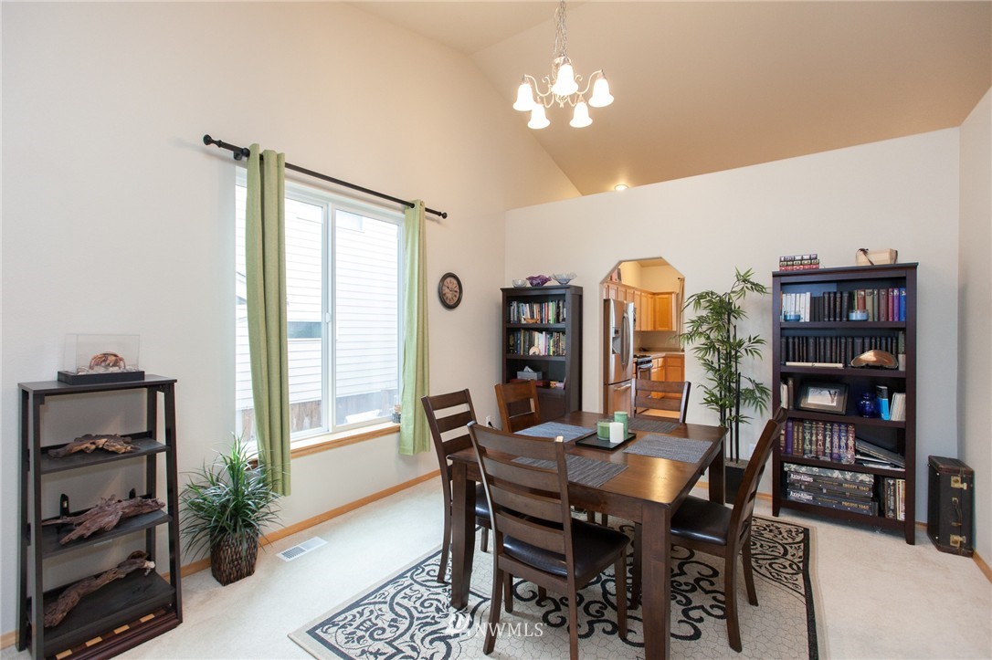 6745 Southeast 5th Street Renton, WA 98059 - Photo 9 of 25 a view of a dining room with furniture and a potted plant