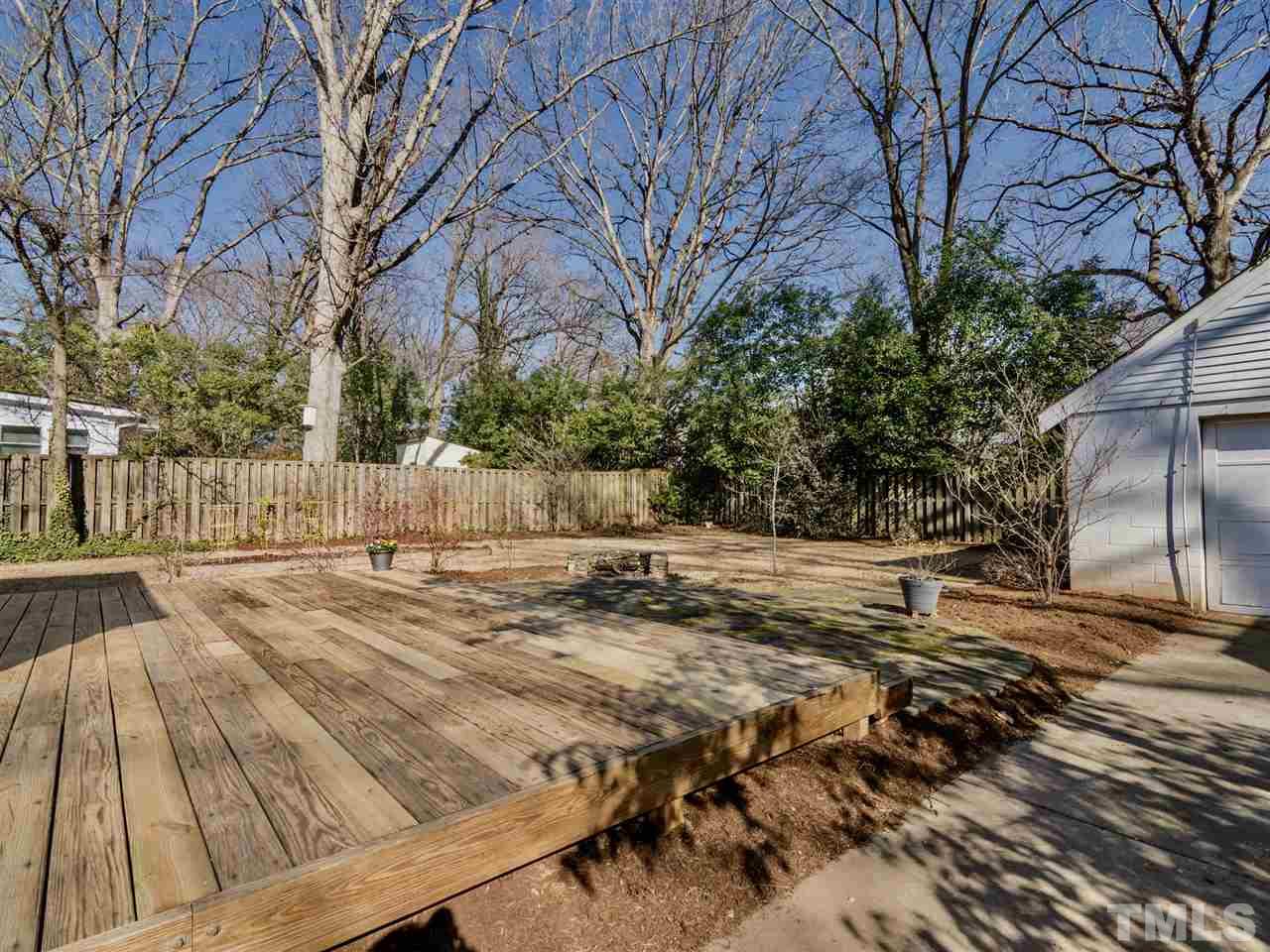 1800 Bennett Street Raleigh, NC 27604 - Photo 14 of 24 Simply A. Maze. Ing. The blueberry bush flanked wood deck leads to a stone patio with fire-pit and carries on to a stone walkway to a gate at the back of the property. What's on the other side of that gate?