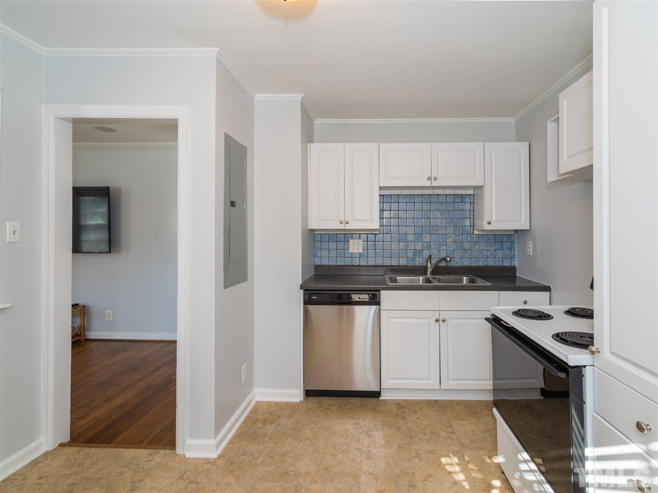 1800 Bennett Street Raleigh, NC 27604 - Photo 10 of 24 View of kitchen showing brand new dishwasher (and disposal). Doorway on left leads back to Living Room area.