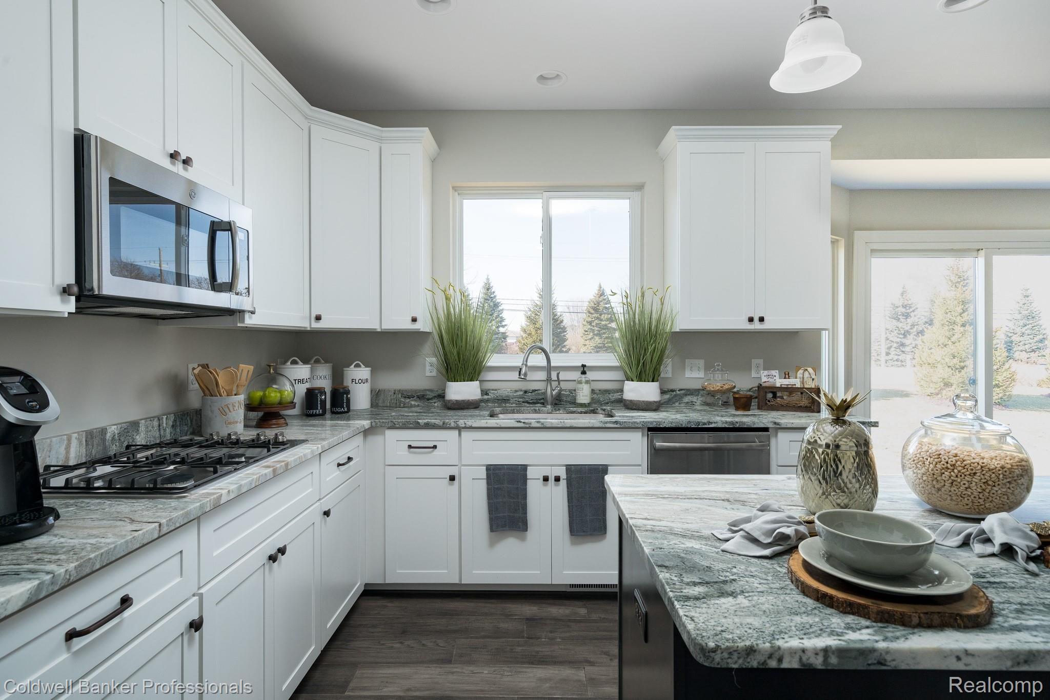 1085 Birkshire Ridge Rochester, MI 48307 - Photo 15 of 34 Granite countertops compliment the white kitchen
