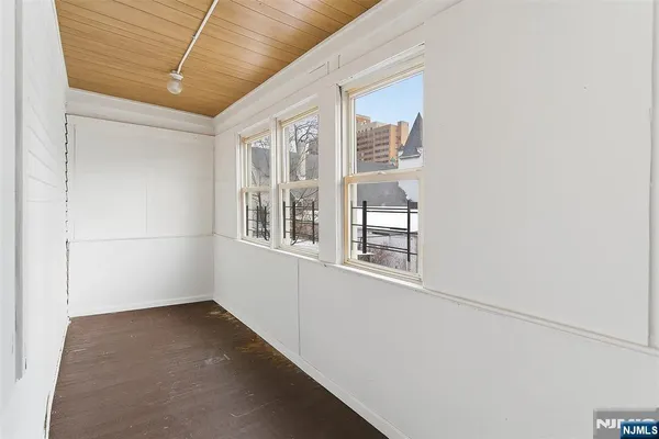 a view of empty room with windows