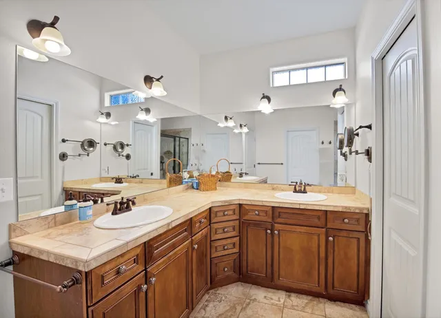 a living room with furniture gym equipment and a large window