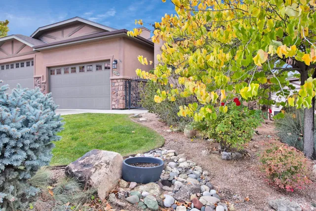 a front view of a house with garden