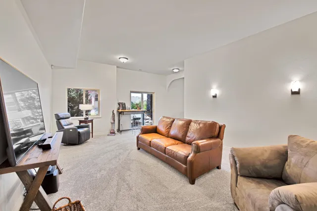 a bedroom with a bed and a chair