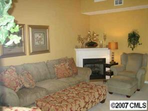8320 Rudolph Road Charlotte, NC 28216 - Photo 2 of 8 a living room with furniture and a fireplace
