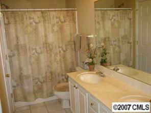 8320 Rudolph Road Charlotte, NC 28216 - Photo 6 of 8 a bathroom with a sink and a shower