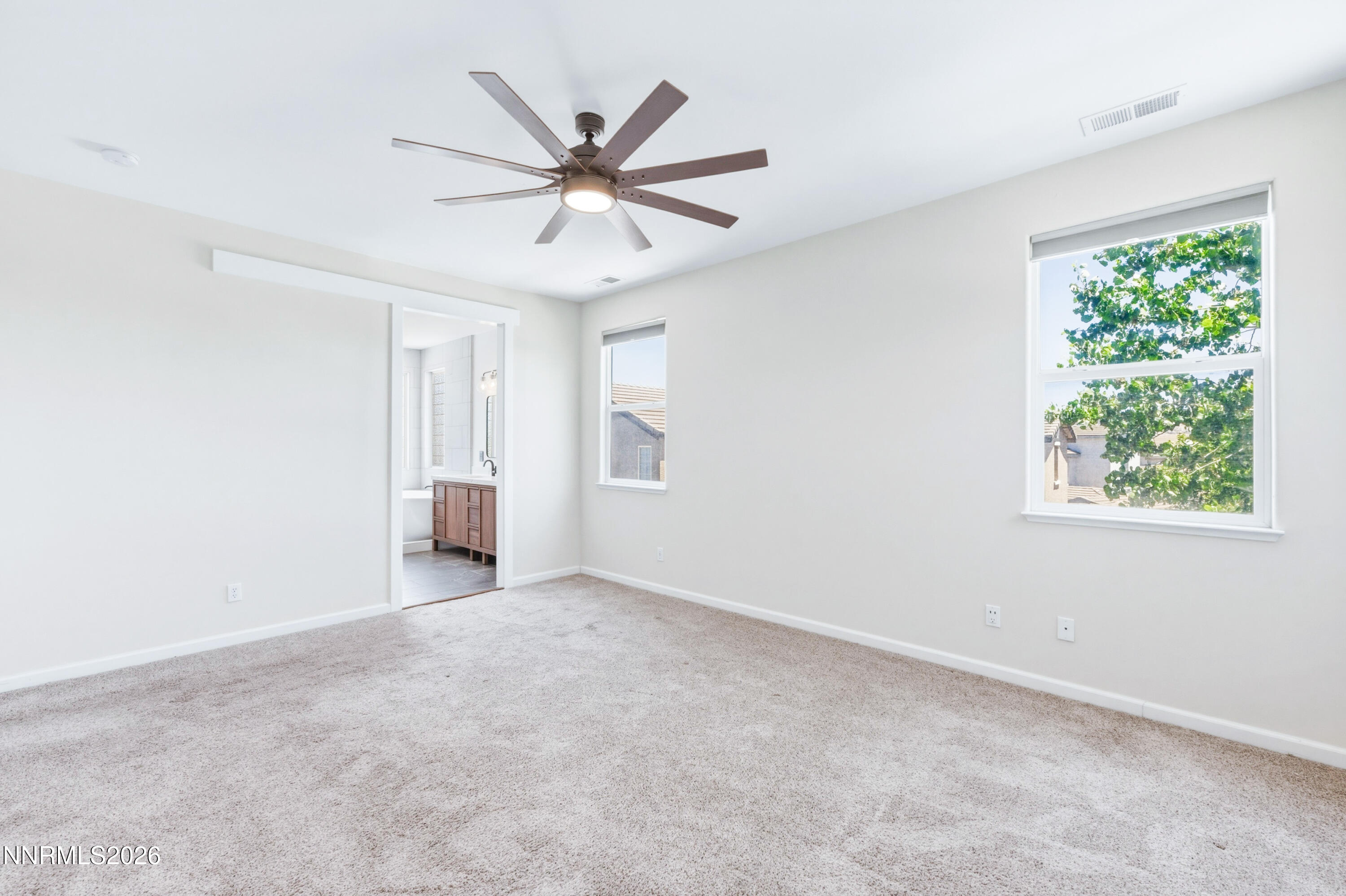 1770 Kodiak Circle Reno, NV 89511 - Photo 19 of 32 a view of a livingroom with a ceiling fan and window