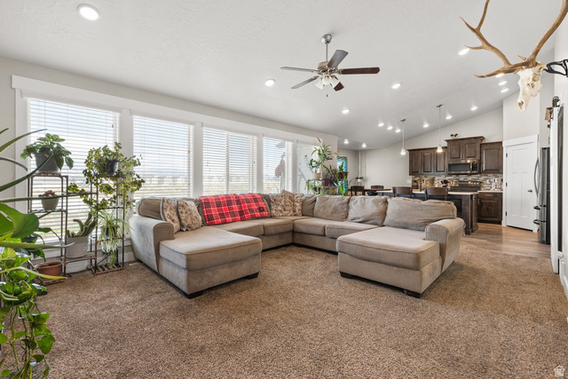463 South Trejo Ridge Road Grantsville, UT 84029 - Photo 3 of 22 Spacious living area featuring a vaulted ceiling with recessed lighting and a ceiling fan
