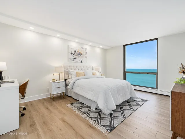 a spacious bedroom with a bed and a window