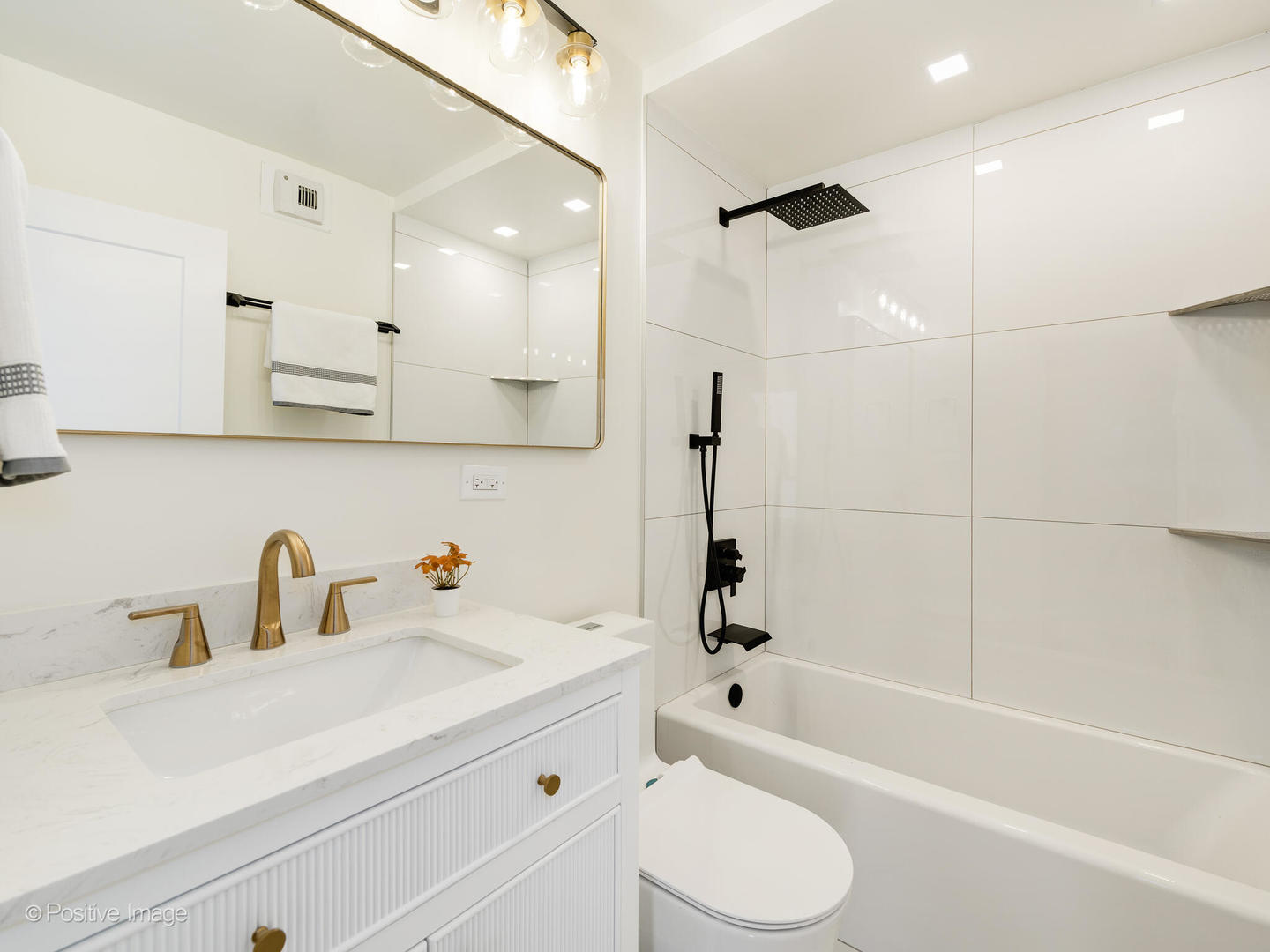 1310 North Ritchie Court, Unit 27C Chicago, IL 60610 - Photo 18 of 30 a bathroom with a sink a toilet and bathtub