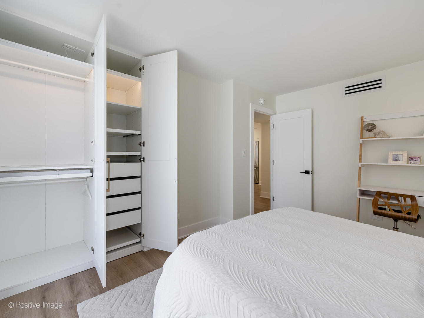 1310 North Ritchie Court, Unit 27C Chicago, IL 60610 - Photo 20 of 30 a bedroom with a bed and a chair