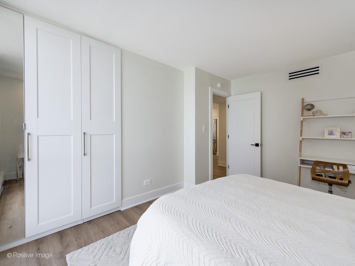 1310 North Ritchie Court, Unit 27C Chicago, IL 60610 - Photo 21 of 30 a bedroom with a bed and a cabinets