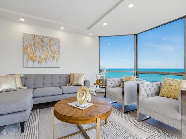 a living room with furniture and a large window