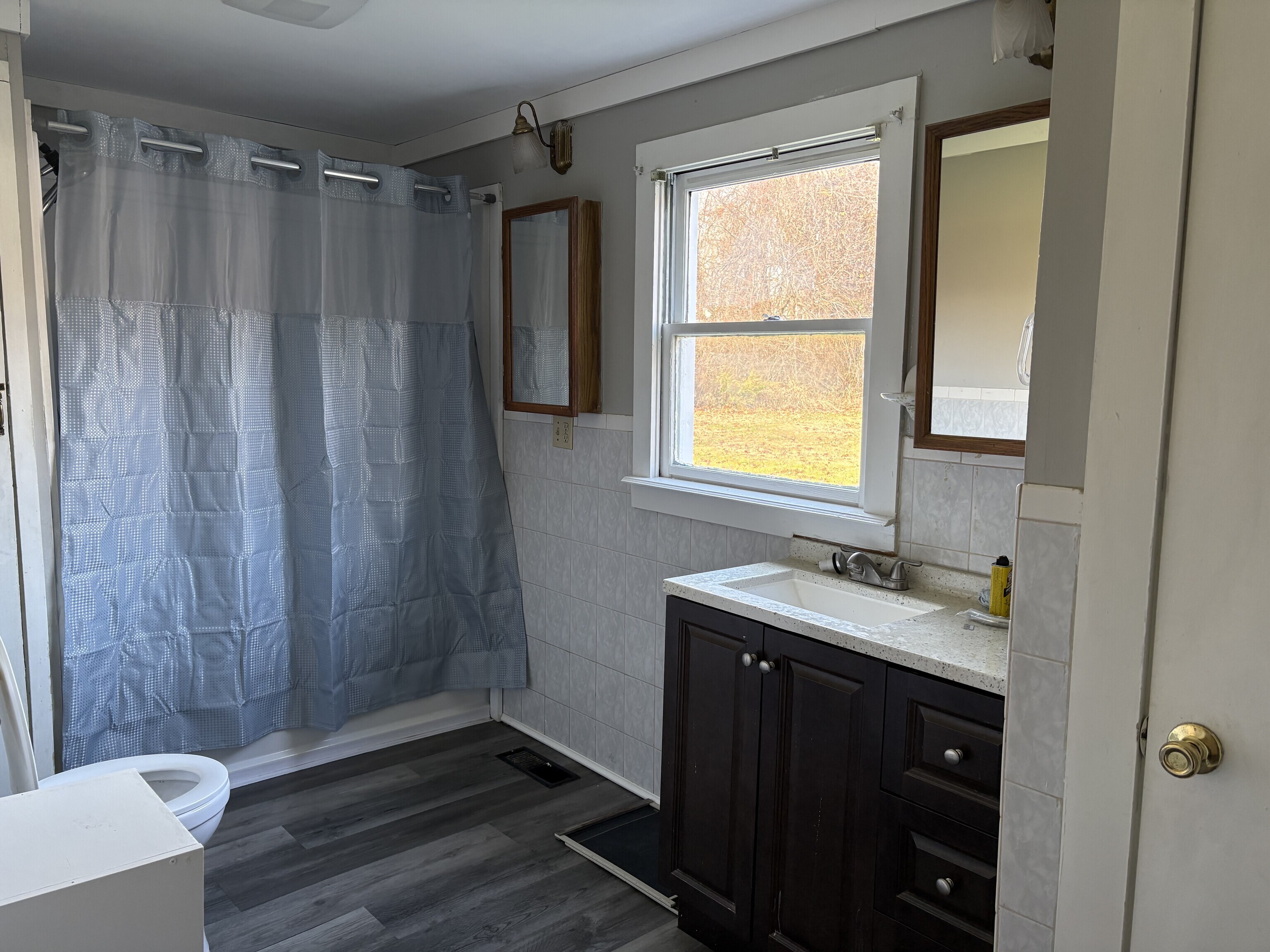 152 Blacks Road Cheshire, CT 06410 - Photo 11 of 14 a bathroom with a sink a mirror and a shower