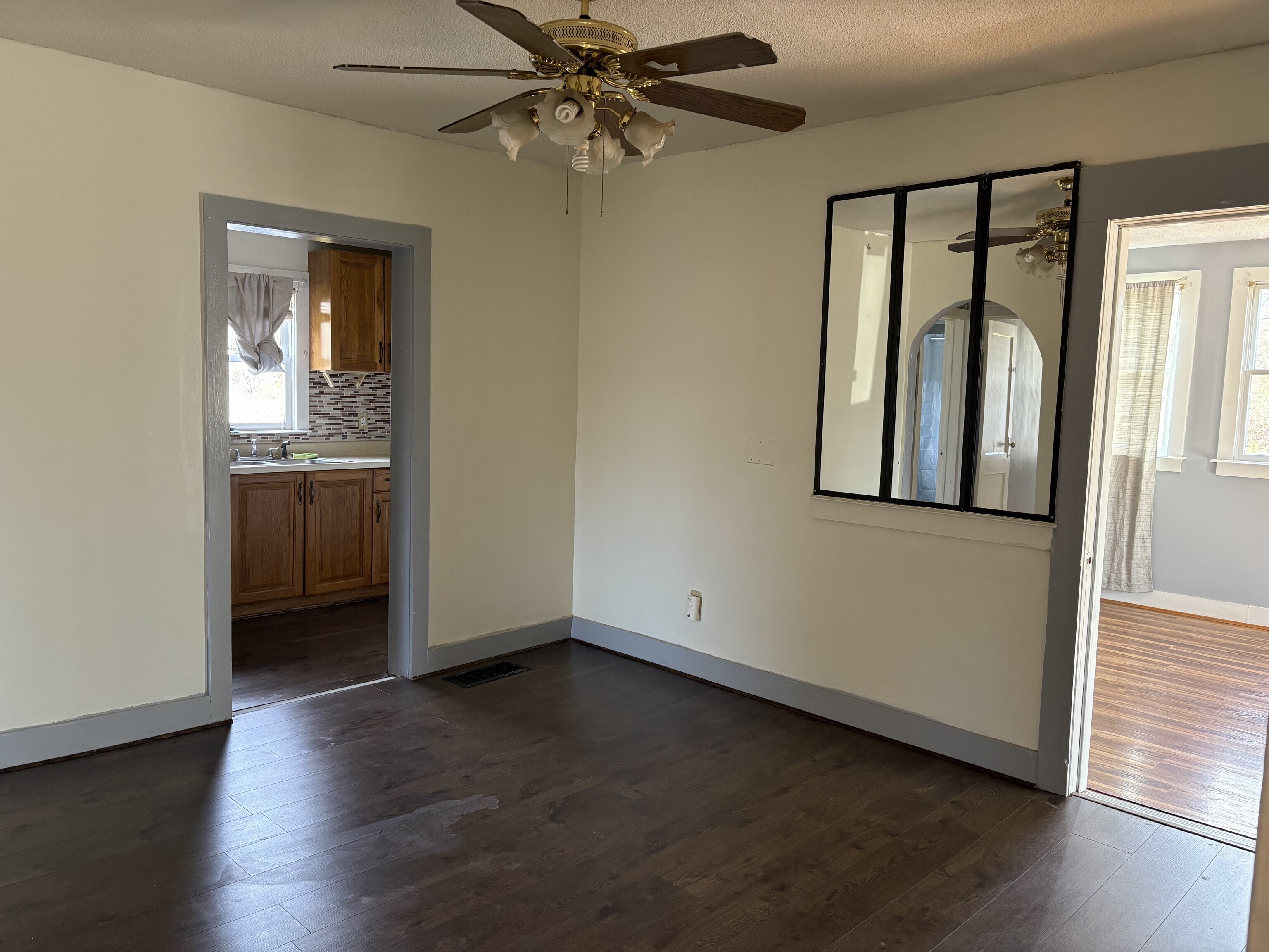 152 Blacks Road Cheshire, CT 06410 - Photo 5 of 14 an empty room with wooden floor cabinet and windows