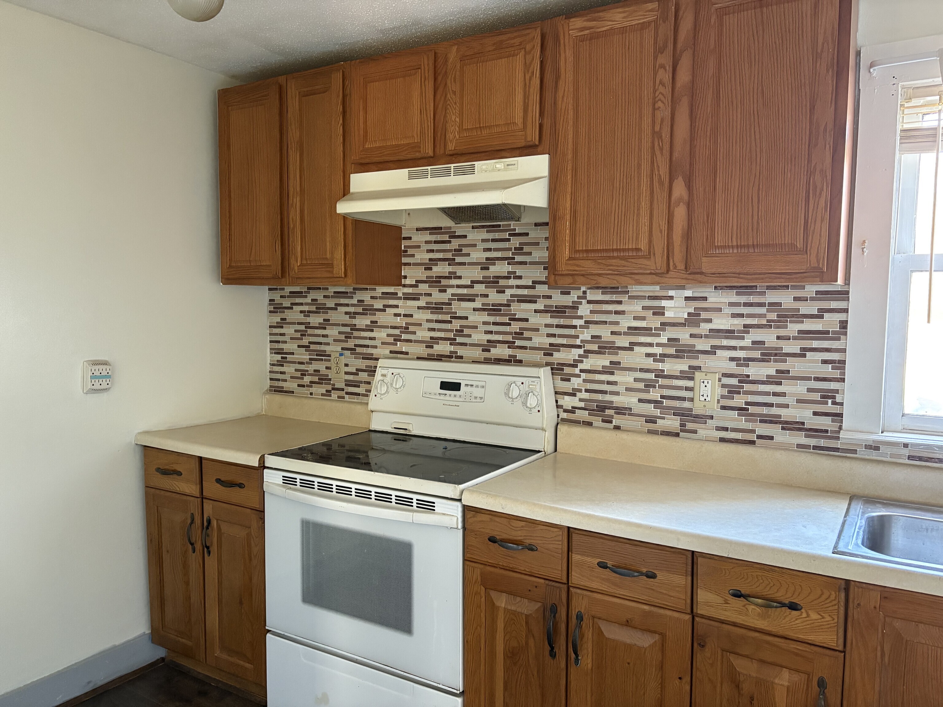152 Blacks Road Cheshire, CT 06410 - Photo 6 of 14 a kitchen with granite countertop cabinets stainless steel appliances and a sink