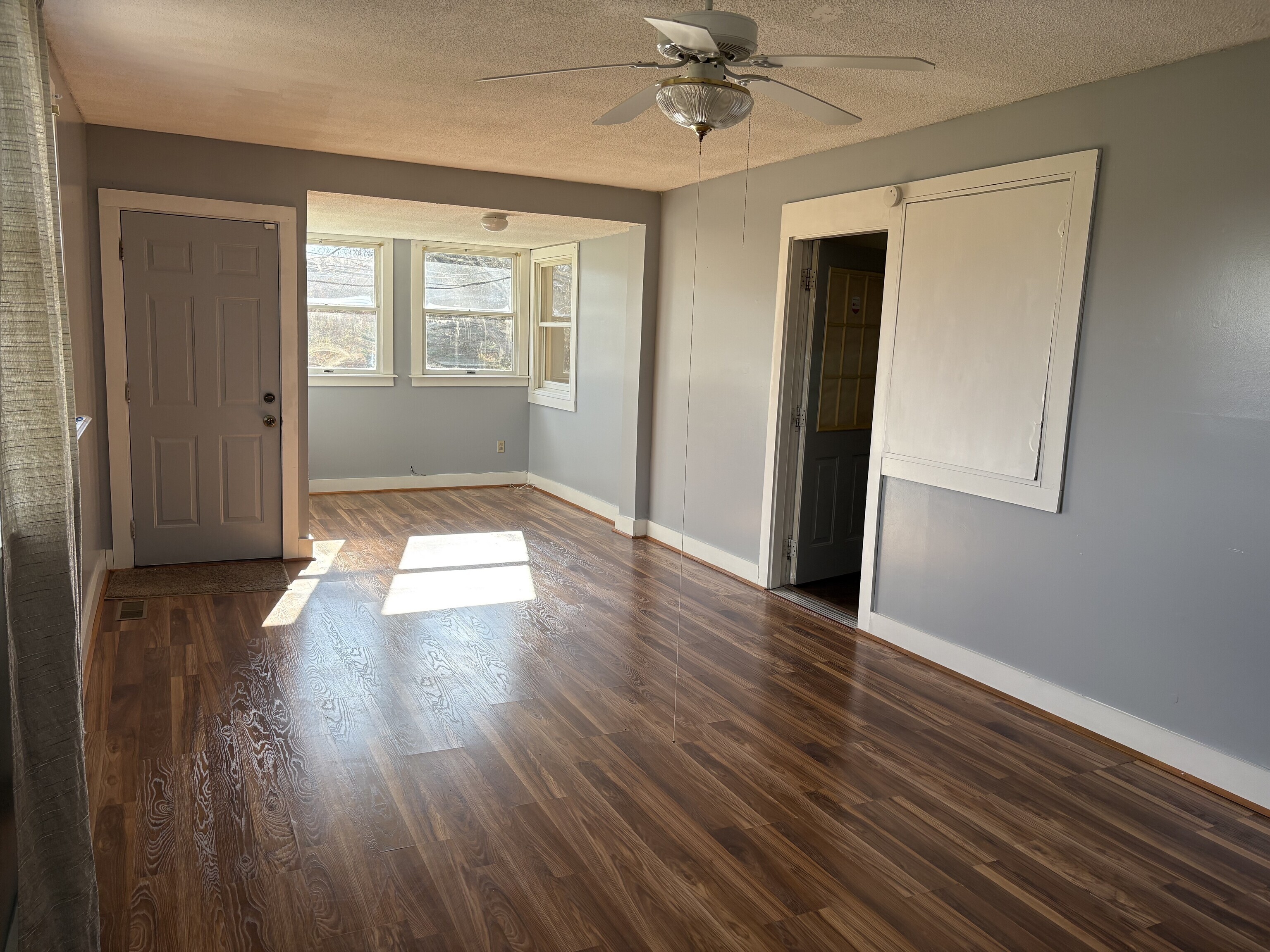 152 Blacks Road Cheshire, CT 06410 - Photo 9 of 14 a view of an empty room with wooden floor and a window