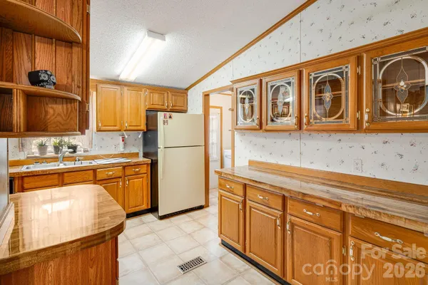 a white bath tub sitting next to a shower