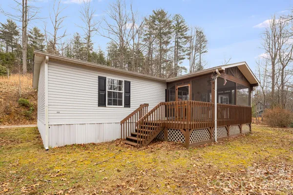 a room with wooden floor and furniture