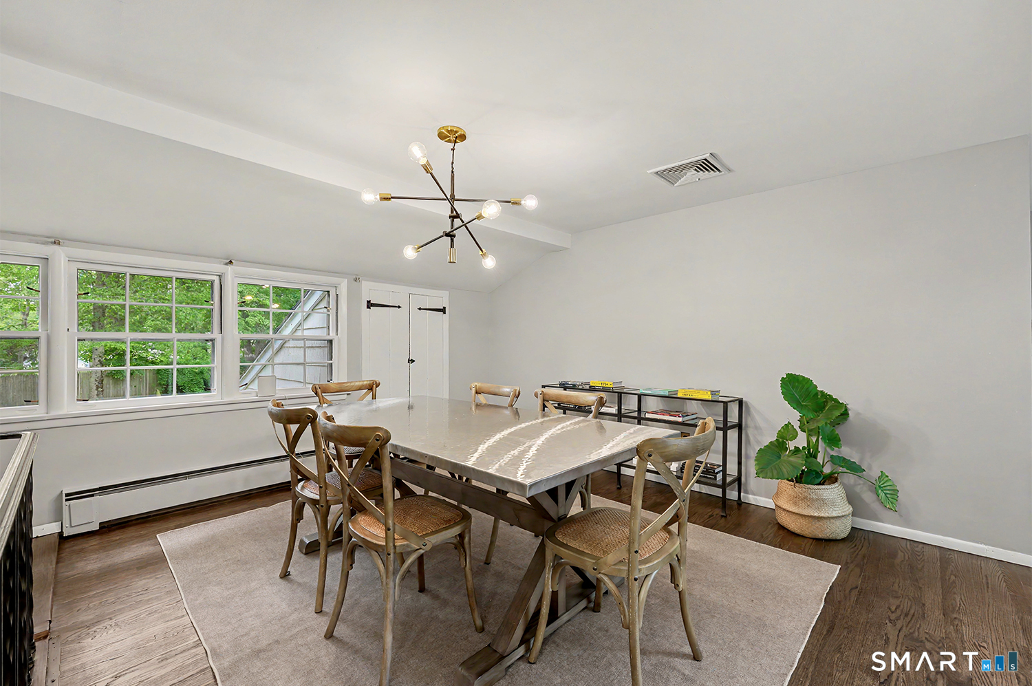 19 Geneva Road Norwalk, CT 06850 - Photo 9 of 33 a view of a dining room with furniture and a potted plant