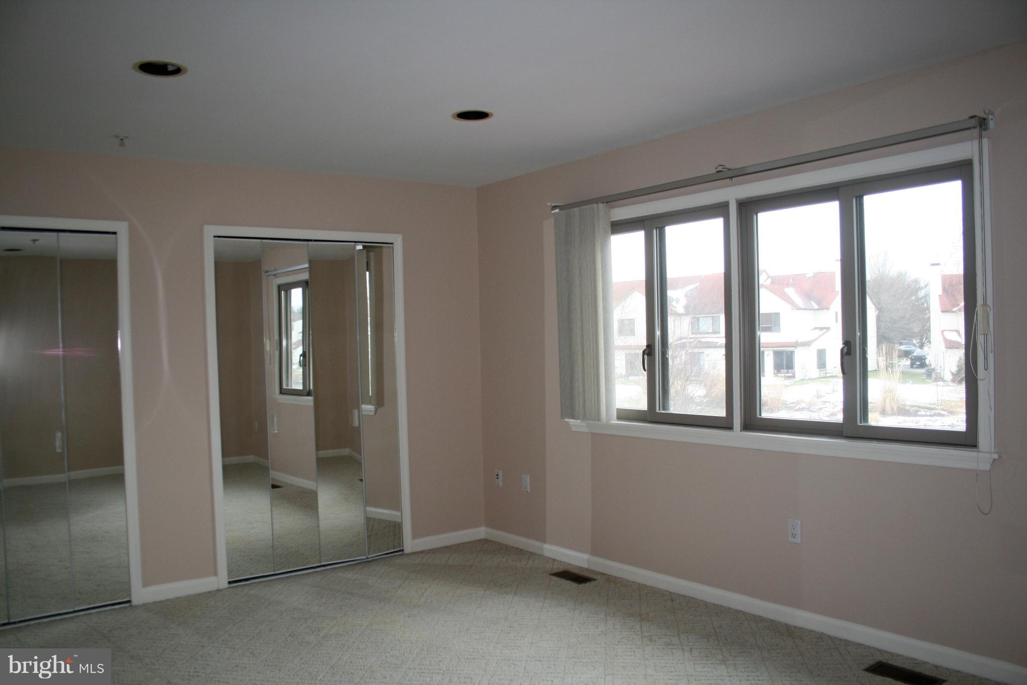 35 F Queen Anne Way Chester, MD 21619 - Photo 12 of 20 a view of an empty room with a window