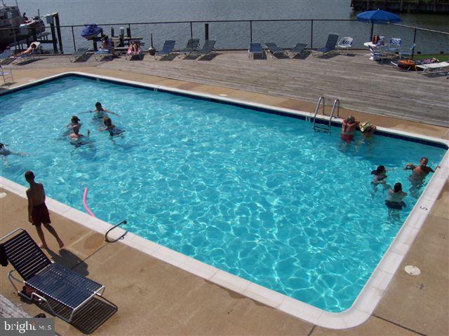 35 F Queen Anne Way Chester, MD 21619 - Photo 15 of 20 a view of swimming pool from a balcony