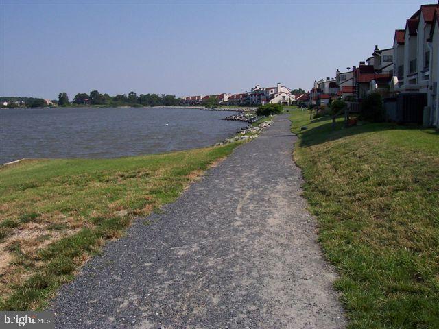 35 F Queen Anne Way Chester, MD 21619 - Photo 19 of 20 a view of a lake with houses in the back