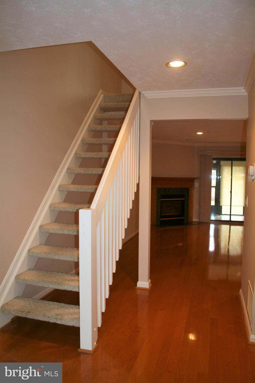 35 F Queen Anne Way Chester, MD 21619 - Photo 6 of 20 a view of entryway and hall with wooden floor