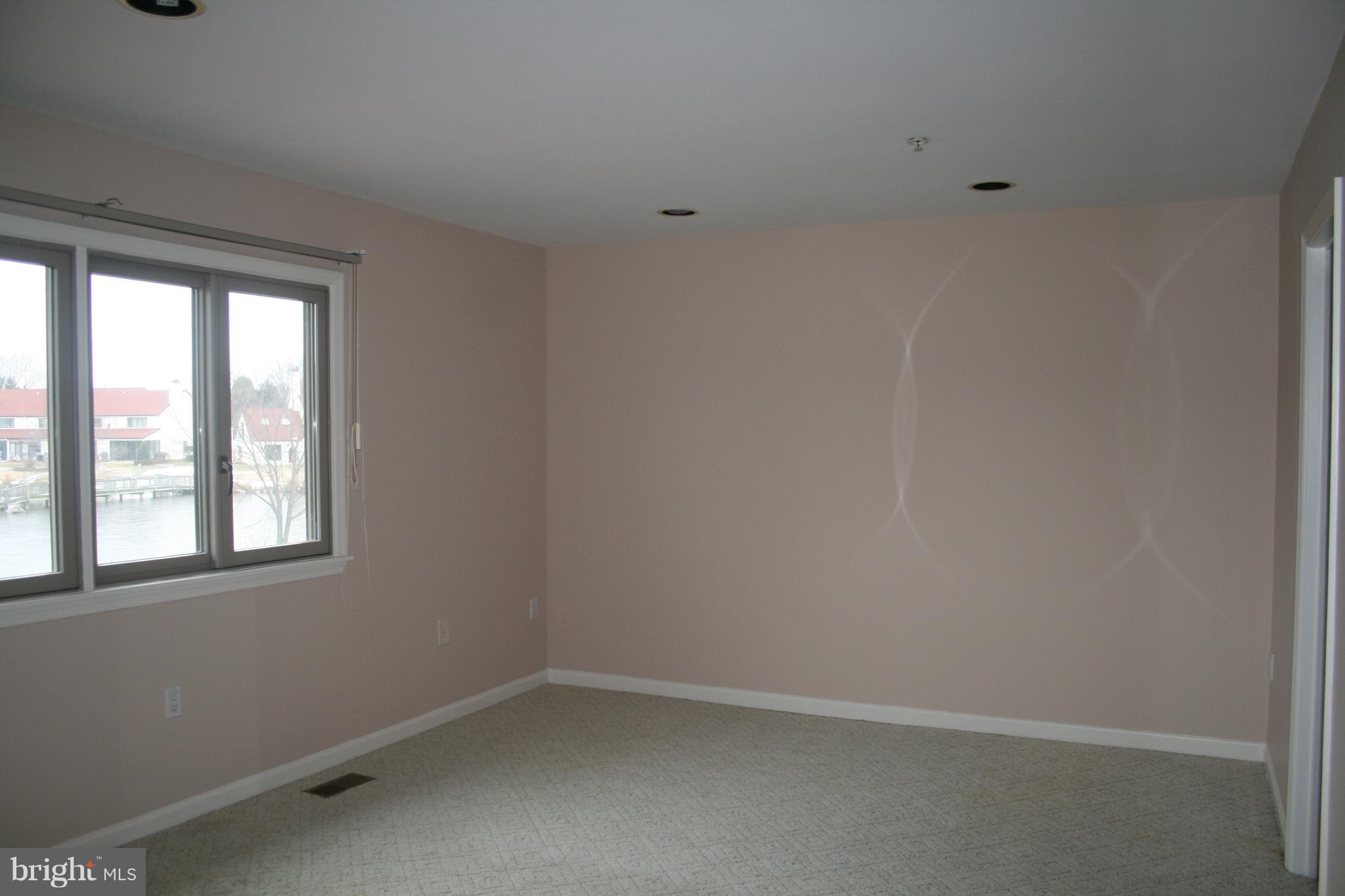 35 F Queen Anne Way Chester, MD 21619 - Photo 10 of 20 an empty room with a window