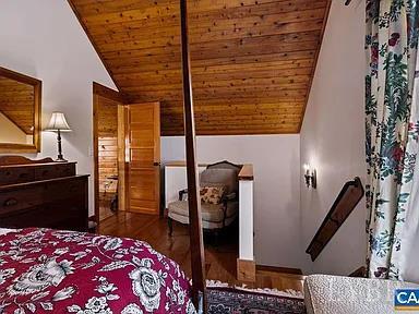 325 Old Roseland Road Roseland, VA 22967 - Photo 53 of 69 a bedroom with a bed and wooden floor