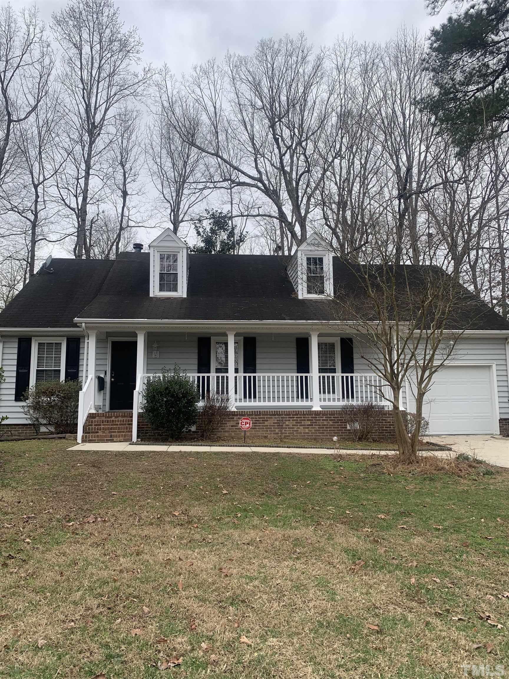 11805 North Exeter Way Raleigh, NC 27613 - Photo 1 of 19 a front view of a house with a yard