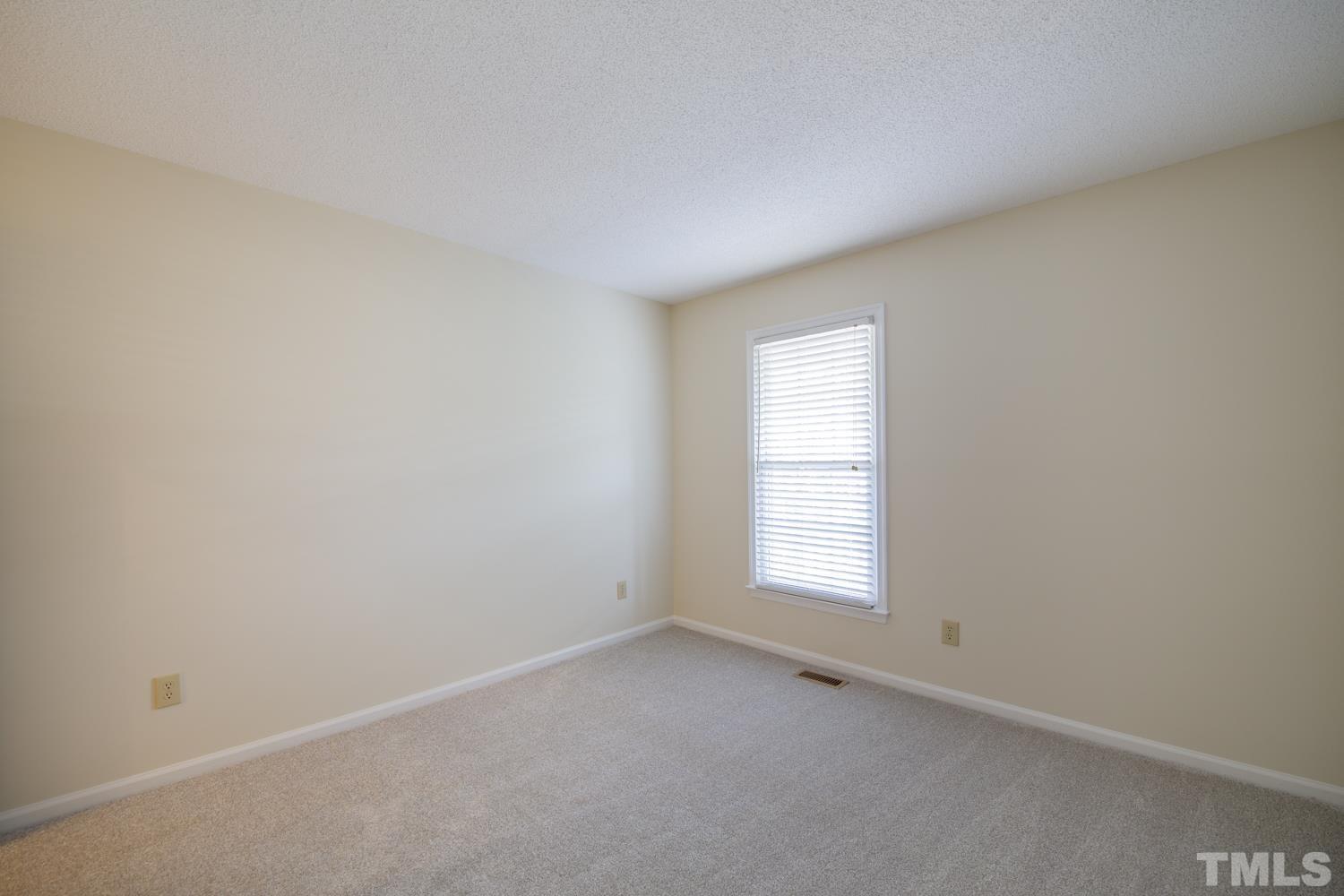 11805 North Exeter Way Raleigh, NC 27613 - Photo 12 of 19 an empty room with a window