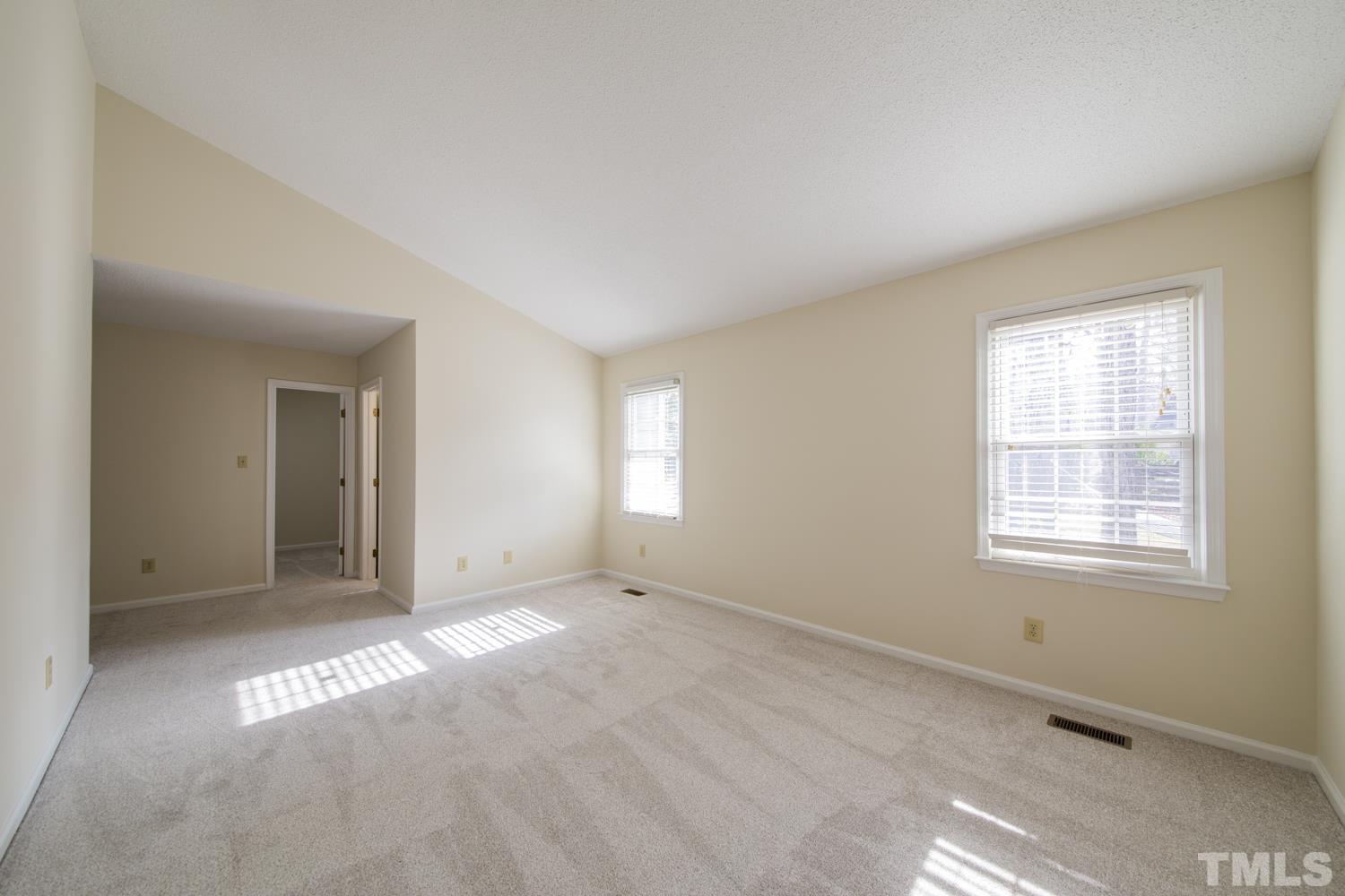 11805 North Exeter Way Raleigh, NC 27613 - Photo 15 of 19 an empty room with windows