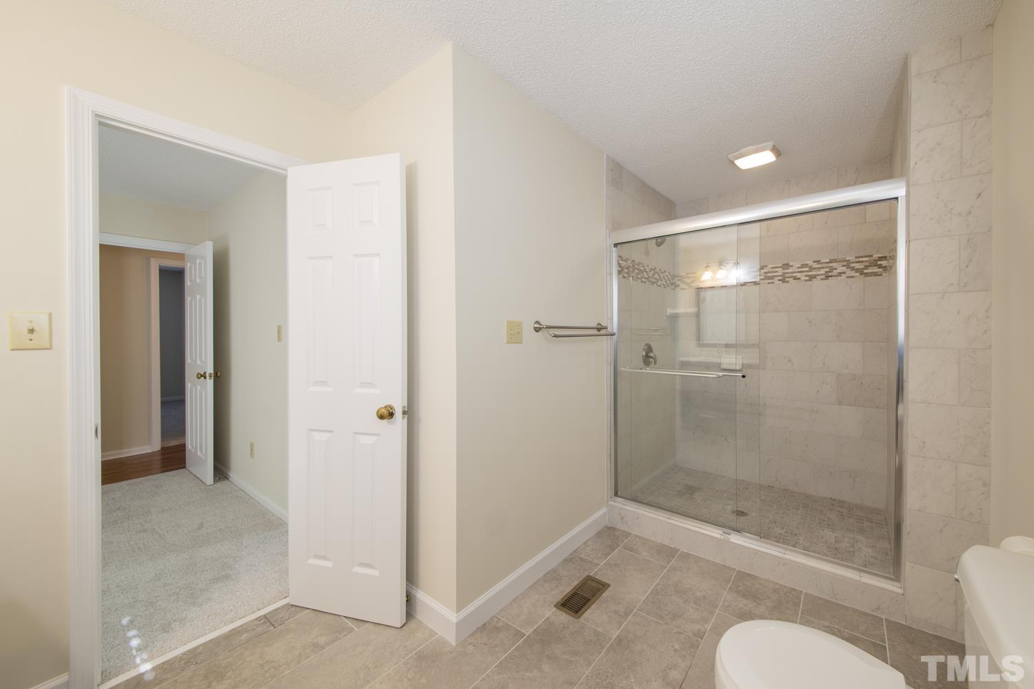 11805 North Exeter Way Raleigh, NC 27613 - Photo 17 of 19 a bathroom with a shower