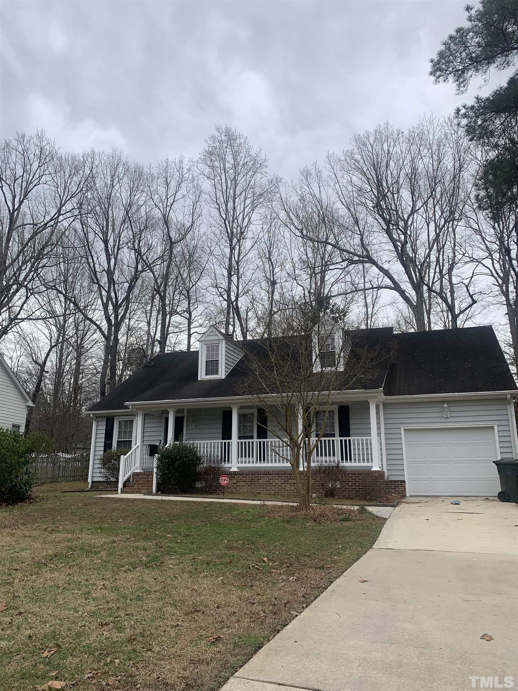 11805 North Exeter Way Raleigh, NC 27613 - Photo 2 of 19 front view of a house with a yard