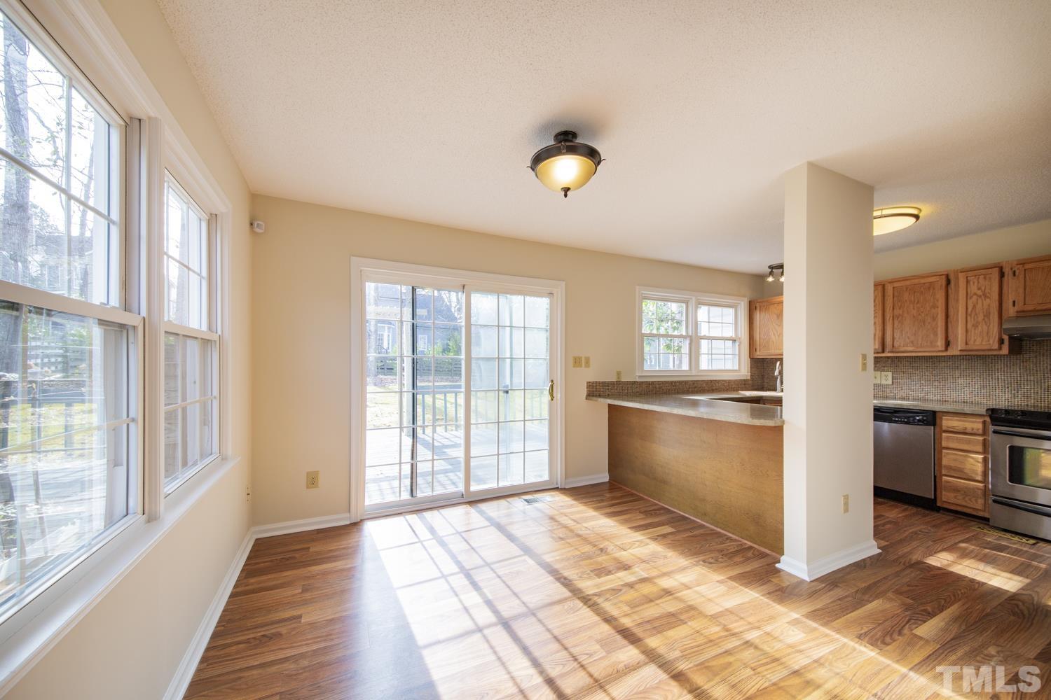 11805 North Exeter Way Raleigh, NC 27613 - Photo 6 of 19 a view of a kitchen with a stove top oven