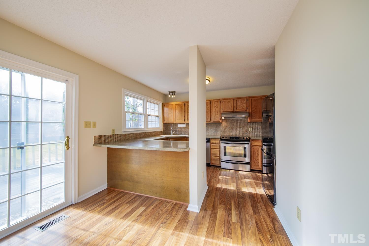 11805 North Exeter Way Raleigh, NC 27613 - Photo 8 of 19 a view of a hardwood floor in a room