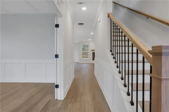 a view of a kitchen with wooden floor and a kitchen