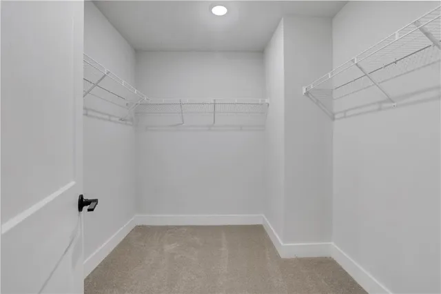 a view of a house with a wooden deck