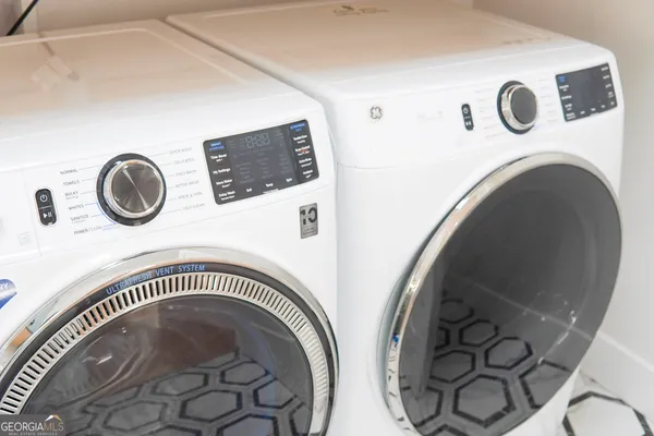 a close up of a washer dryer and a table